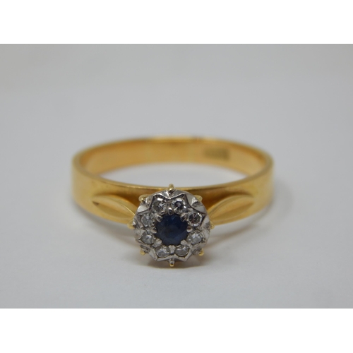 277 - 18ct Yellow Gold Ring Set with a central sapphire within a border of diamonds: Ring size P: gross we... 