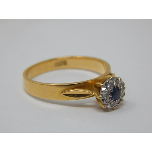 277 - 18ct Yellow Gold Ring Set with a central sapphire within a border of diamonds: Ring size P: gross we... 