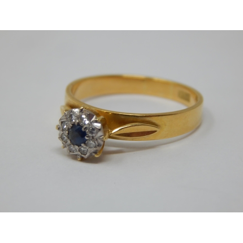 277 - 18ct Yellow Gold Ring Set with a central sapphire within a border of diamonds: Ring size P: gross we... 