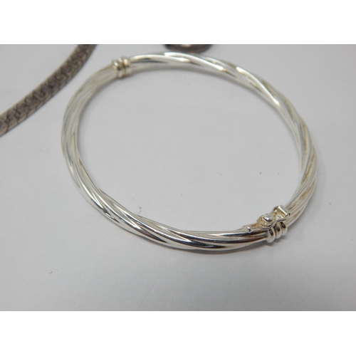 283 - A Quantity of Sterling Silver Jewellery to Include Necklaces, Bangles, Rings etc together with a US ... 