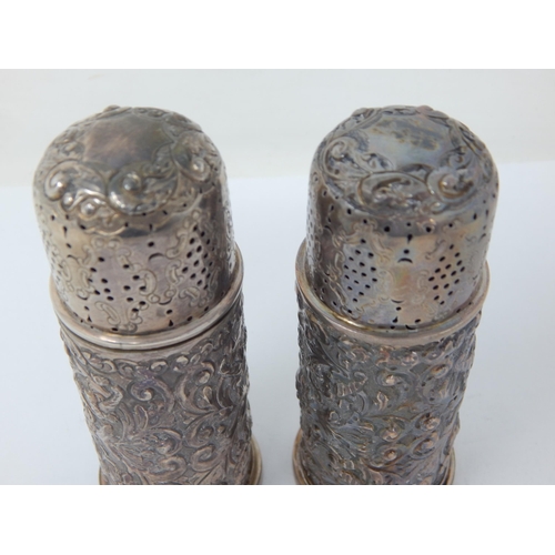 108 - Pair of Victorian Silver Pepper Casters: Hallmarked London 1892 by Edgar Finley & Hugh Taylor: 10cm ... 