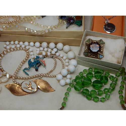 139 - A Large Quantity of Costume Jewellery & Jewellery Boxes contained in a suitcase.
