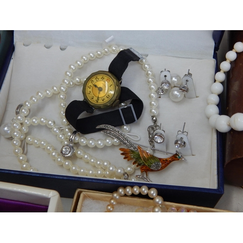 139 - A Large Quantity of Costume Jewellery & Jewellery Boxes contained in a suitcase.