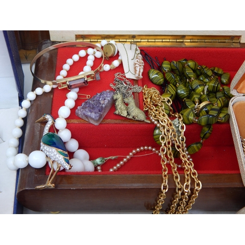 139 - A Large Quantity of Costume Jewellery & Jewellery Boxes contained in a suitcase.