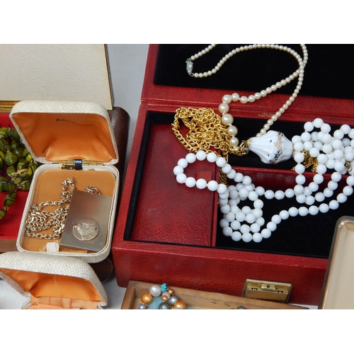 139 - A Large Quantity of Costume Jewellery & Jewellery Boxes contained in a suitcase.