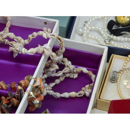 139 - A Large Quantity of Costume Jewellery & Jewellery Boxes contained in a suitcase.