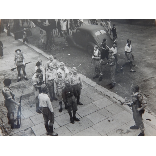 WWII: A Quantity of B&W Photographs showing the signing of the surrender by the Japanese aboard the U.S Battleship Missouri together with further photographs including Japanese soldiers being disarmed in Hong Kong (lot)