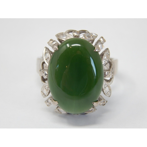 61 - 18ct White Gold Ring Set with a Central Jade Cabochon: Ring Size Q: Gross weight 9.22g