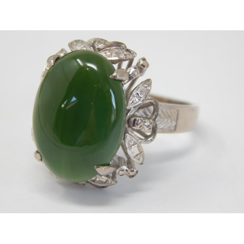 61 - 18ct White Gold Ring Set with a Central Jade Cabochon: Ring Size Q: Gross weight 9.22g