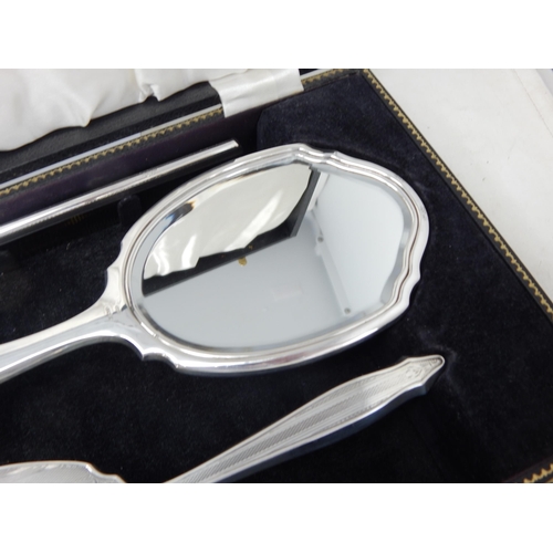 100 - Cased set of Elizabeth II silver four piece dressing table set,
Birmingham 1964,