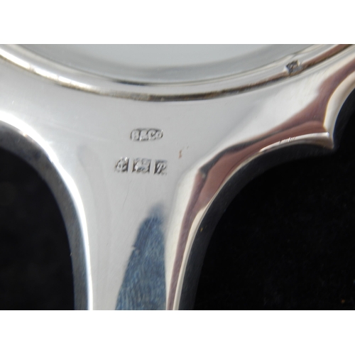 100 - Cased set of Elizabeth II silver four piece dressing table set,
Birmingham 1964,