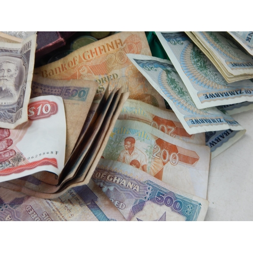 87A - A Quantity of World Banknotes & Coins contained in a bag.