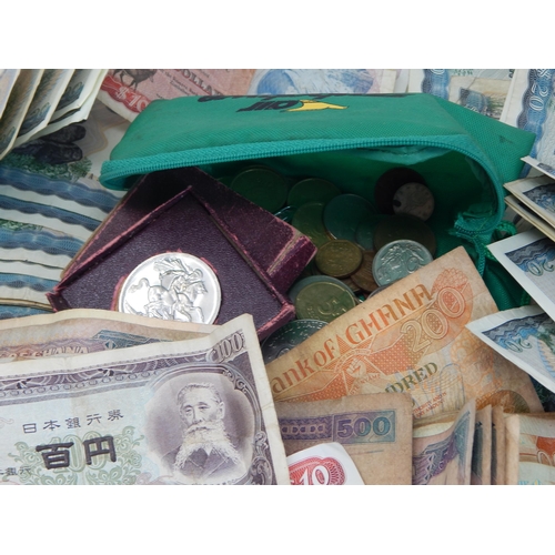 87A - A Quantity of World Banknotes & Coins contained in a bag.