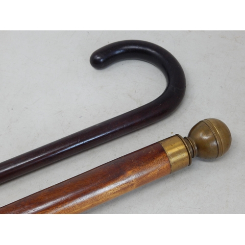 Brass Topped Walking Cane. The sprung top unscrewing to reveal an inner  flask 83.5cm high together w