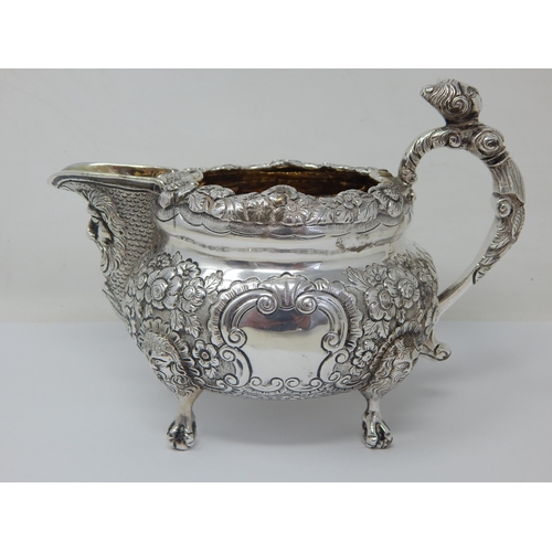 100 - Heavy Gauge George IV Irish Silver Jug with Foliate Decoration to the Rim & Body with Vacant Cartouc... 