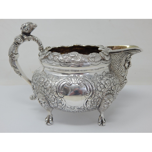 100 - Heavy Gauge George IV Irish Silver Jug with Foliate Decoration to the Rim & Body with Vacant Cartouc... 