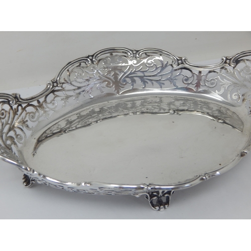 102 - Silver Bread Basket with Pierced Shaped Body Sitting on Four upswept Pierced feet: Measuring 24cm wi... 