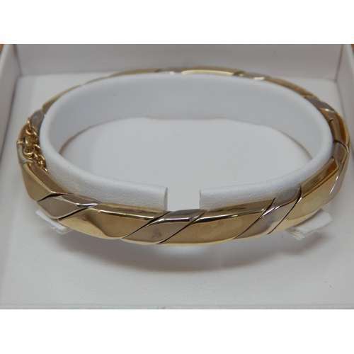 235 - 9ct Gold Hinged Bangle with Safety Chain in Original Fitted Case by Swag: Weight 21.41g