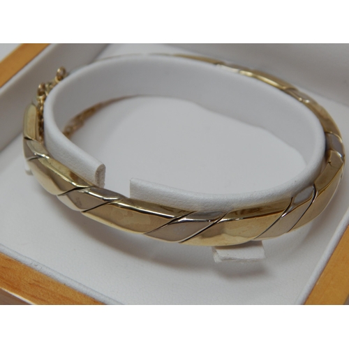 235 - 9ct Gold Hinged Bangle with Safety Chain in Original Fitted Case by Swag: Weight 21.41g