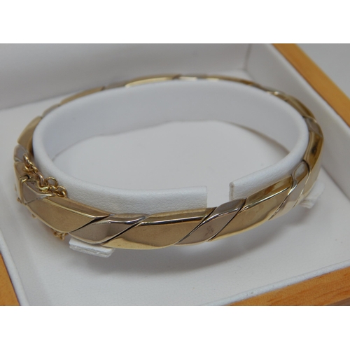 235 - 9ct Gold Hinged Bangle with Safety Chain in Original Fitted Case by Swag: Weight 21.41g