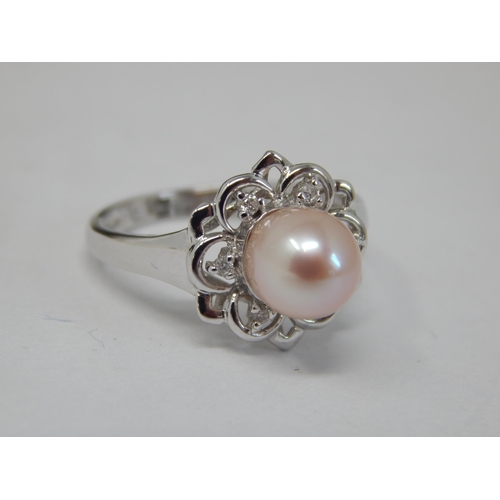 322 - 9ct White Gold Pearl Set Ring: Size J: gross weight 2.21g