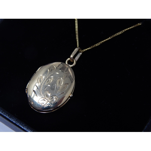 387 - 9ct Yellow Gold Locket on 9ct Gold Chain: Weight 3.56g: In Presentation Box