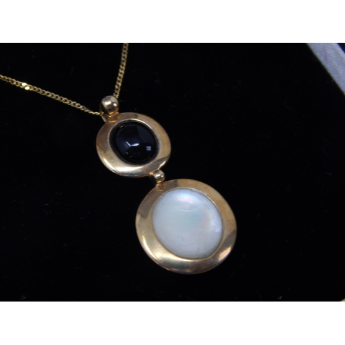 394 - 9ct Yellow Gold Gem Set Pendant on 9ct Gold Chain: Gross weight 2.73g: In Presentation Box