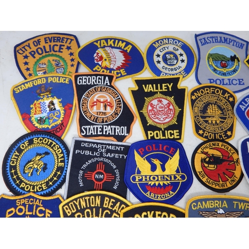 569 - A Collection of 25 Cloth USA Police Badges from a private collection