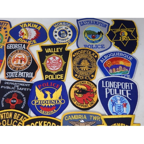 569 - A Collection of 25 Cloth USA Police Badges from a private collection