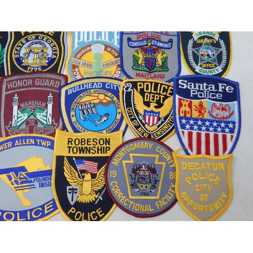 570 - A Collection of 25 Cloth USA Police Badges from a private collection