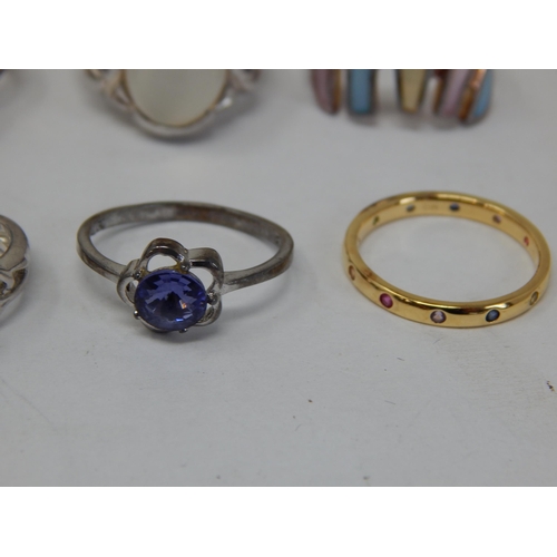 411 - A Collection of 8 Sterling Silver Rings.