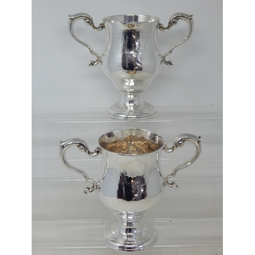 106 - A PAIR OF GEORGE III IRISH SILVER TWO-HANDLED CUPS by Matthew West, Dublin, c.1770, of plain form wi... 