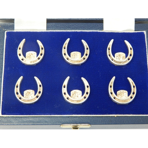 111 - ASPREY: A Set of Silver Menu/Place Name Holders formed as horseshoes: Hallmarked Birmingham 1993 by ... 