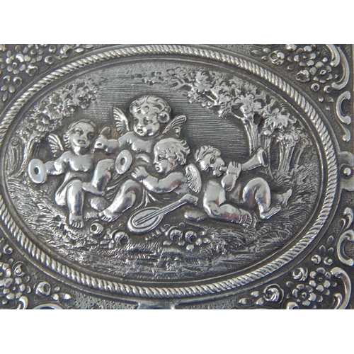 112 - An 800 Standard Silver Case with Gilded Interior: The cover with an embossed scene of putti playing ... 