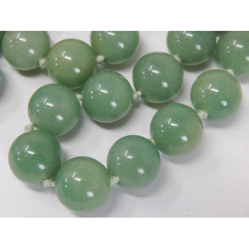 259 - Jade/Jadeite Necklace comprising 50 individually knotted beads with silver & gilded clasp: Length 66... 