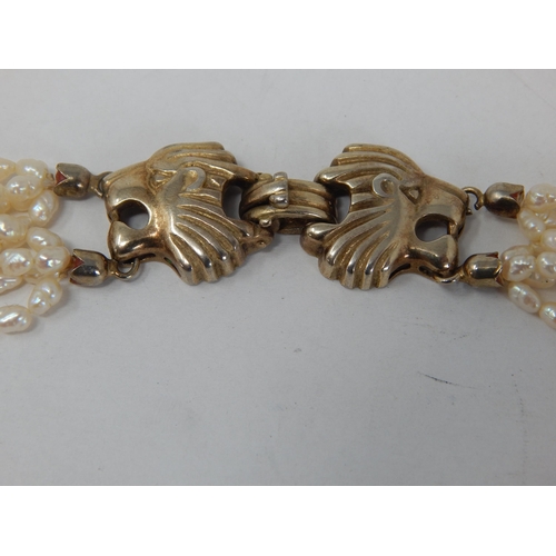 261 - 8 Strand Freshwater Pearl Necklace with Silver Clasp formed as an Oyster: Length 44cm