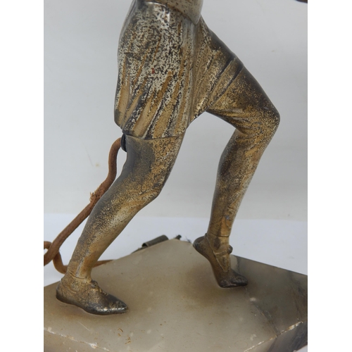 573 - A Period Art Deco Cast Metal Figural Table Lamp, the woman with outstretched arms supporting the lig... 