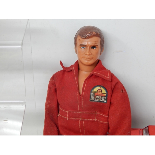 589 - Two 1970's Action Men (One being the bionic man) together with a large quantity of playworn model ve... 