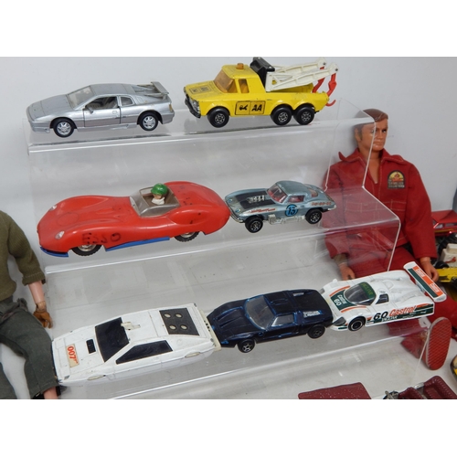 589 - Two 1970's Action Men (One being the bionic man) together with a large quantity of playworn model ve... 