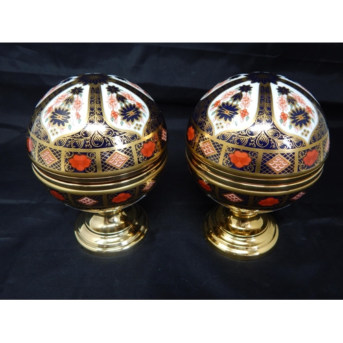 598 - A Royal Crown Derby Old Imari pattern 1128 limited edition Millennium globe thermometer and a Millen... 