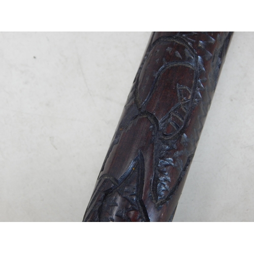 644 - Tribal hardwood staff with carved decoration depicting native figures: 91.5cm (36