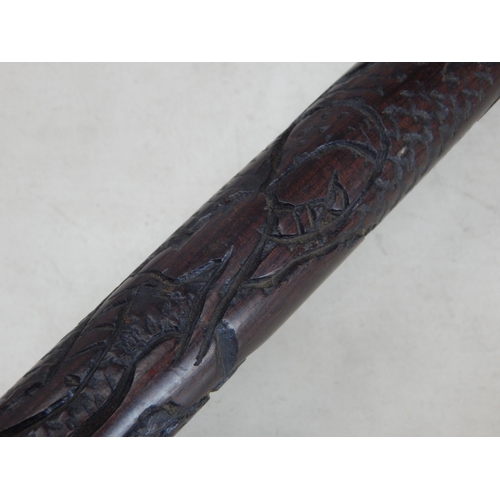 644 - Tribal hardwood staff with carved decoration depicting native figures: 91.5cm (36