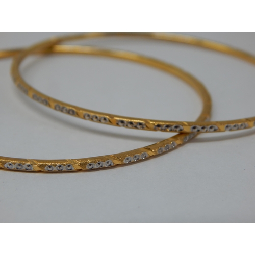 296 - A Pair of Indian 22ct Gold Bangles: Internal Diameter 60mm: Weight 20.59g