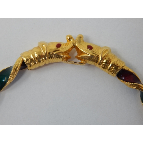 297 - Indian 22ct Gold Bangle of twist design with Ruby & Emerald Coloured Enamels, Fashioned with Elephan... 