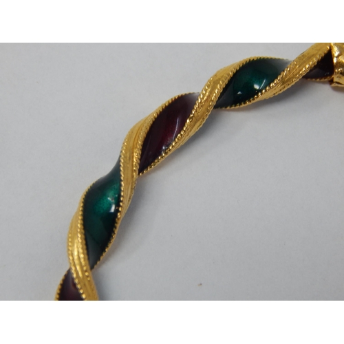 297 - Indian 22ct Gold Bangle of twist design with Ruby & Emerald Coloured Enamels, Fashioned with Elephan... 