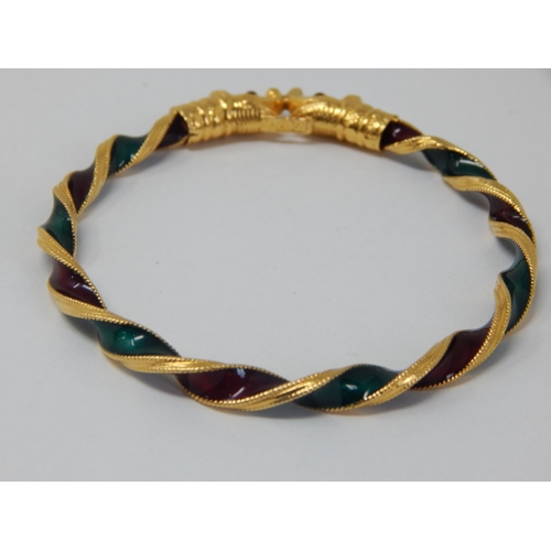 297 - Indian 22ct Gold Bangle of twist design with Ruby & Emerald Coloured Enamels, Fashioned with Elephan... 