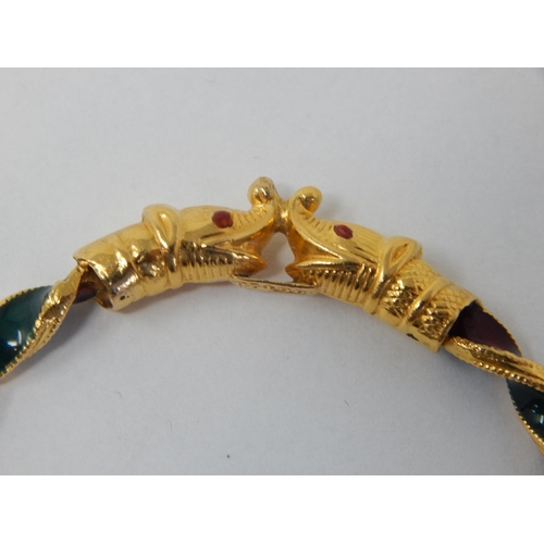 298 - Indian 22ct Gold Bangle of twist design with Ruby & Emerald Coloured Enamels, Fashioned with Elephan... 