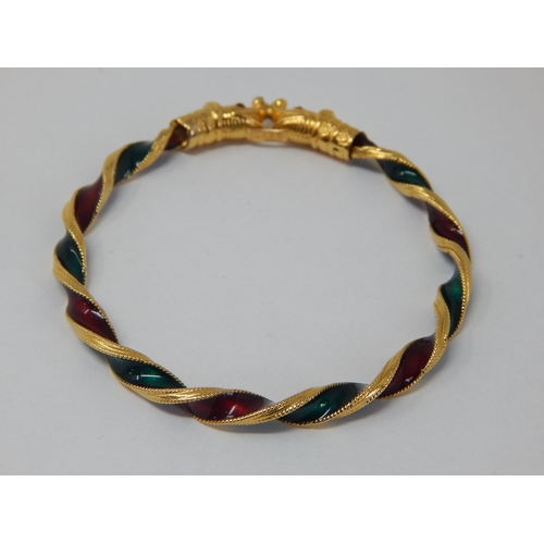 298 - Indian 22ct Gold Bangle of twist design with Ruby & Emerald Coloured Enamels, Fashioned with Elephan... 