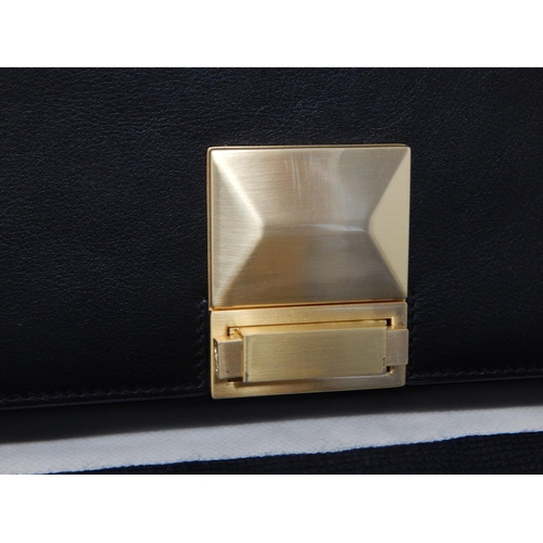 158 - JAEGER: Black Leather Flat Fold Over Bag with Gold Tone Clasp Revealing Inner Pocket in Original Dus... 