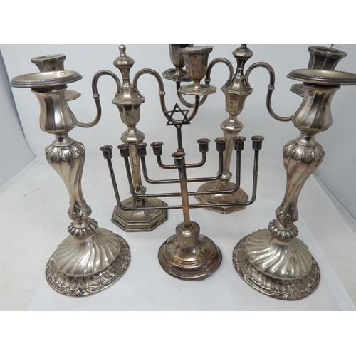 139 - Two Pairs of Silver Plated Candlesticks/Candelabra together with a Plated Menorah.